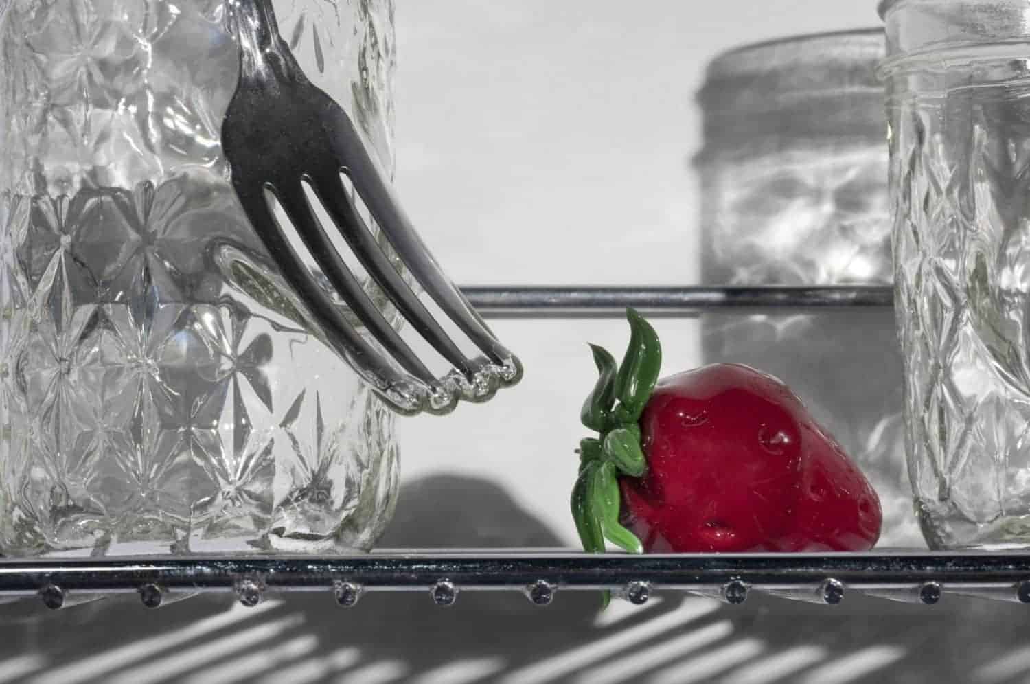 Detail of “From small beginnings come great things,” Jelly jars, cutlery, flame worked glass, stainless steel, 12 x 16 x 6 inches, photo credit: Elizabeth Torgerson-Lamark