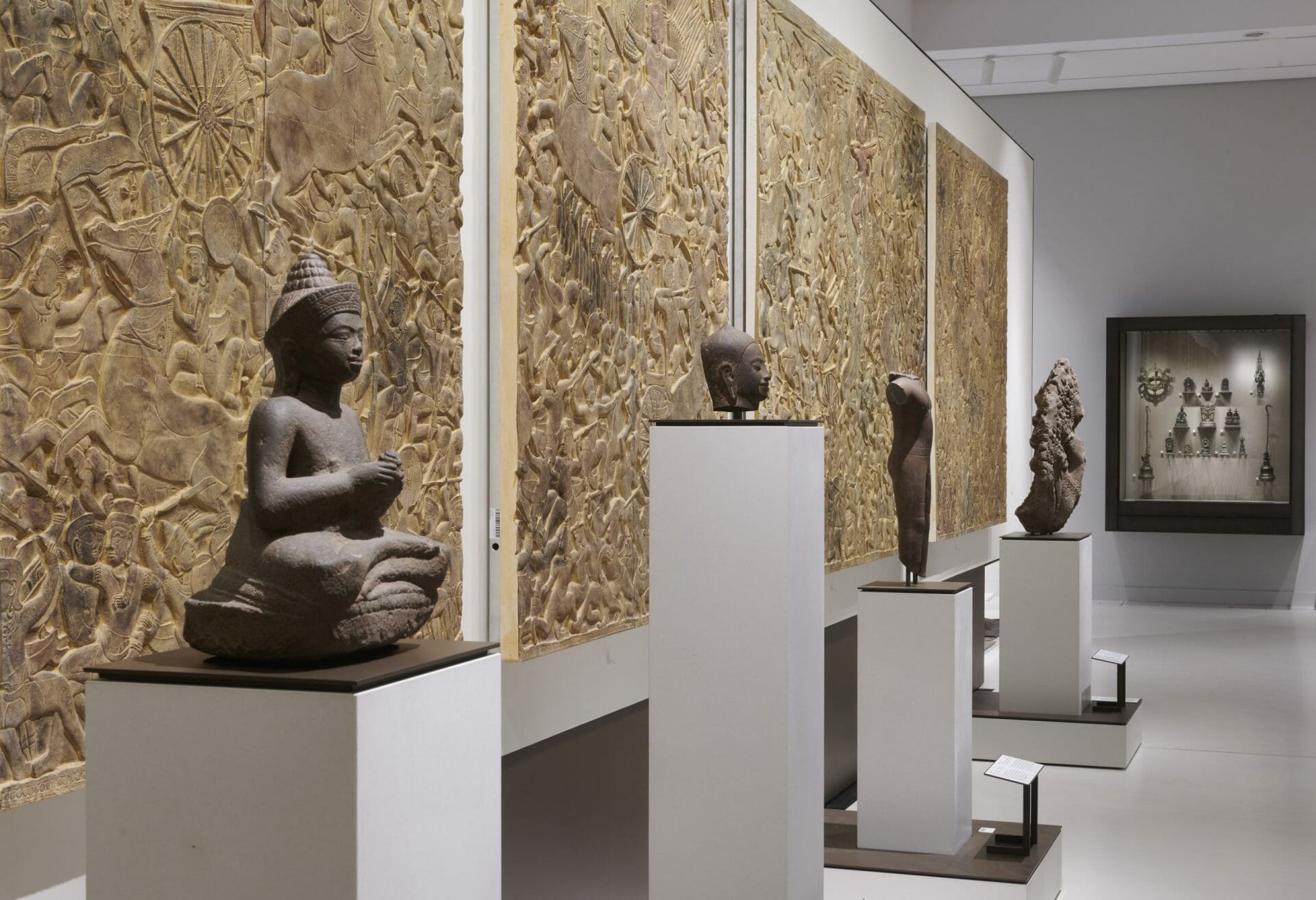 Freshly restored casts of reliefs from Angkor Wat, in the foreground sun or moon shining Bodhisattva (Thailand, 1182-1186), in the exhibition module “Southeast Asia” of the Asian Art Museum at the Humboldt Forum