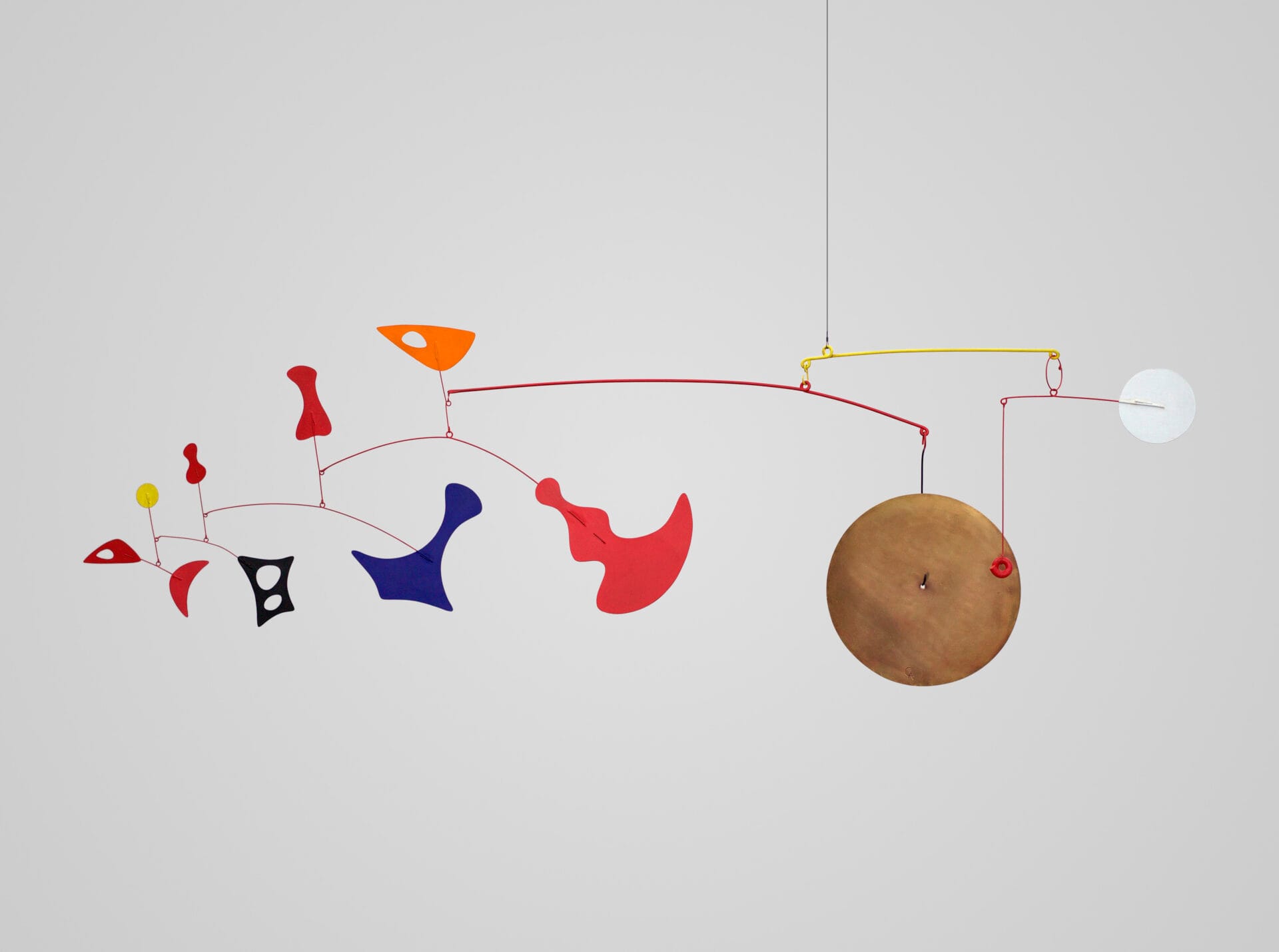 Dispersed Objects with Brass Gong, 1948. Brass, sheet metal, wire, and paint, 19" x 66". Photo courtesy of Calder Foundation, New York / Art Resource, New York