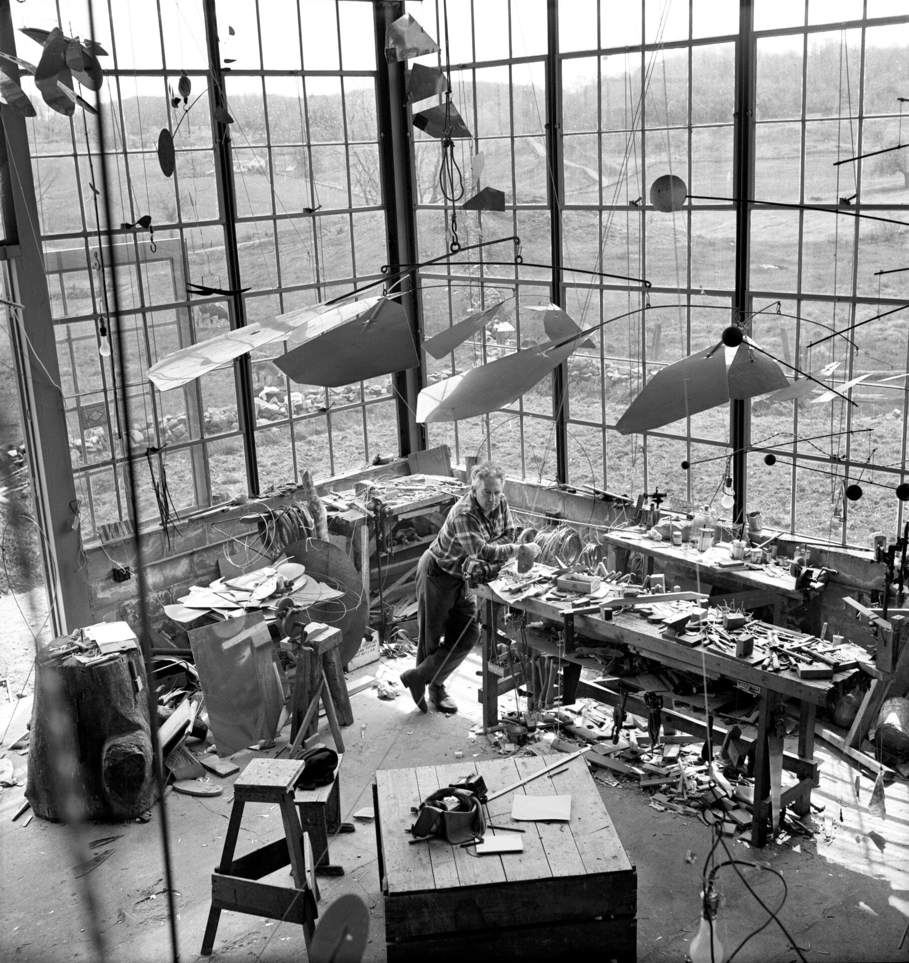 Calder with Mobile (1941) in his Roxbury studio, 1941. Photograph by Herbert Matter © Calder Foundation, New York.