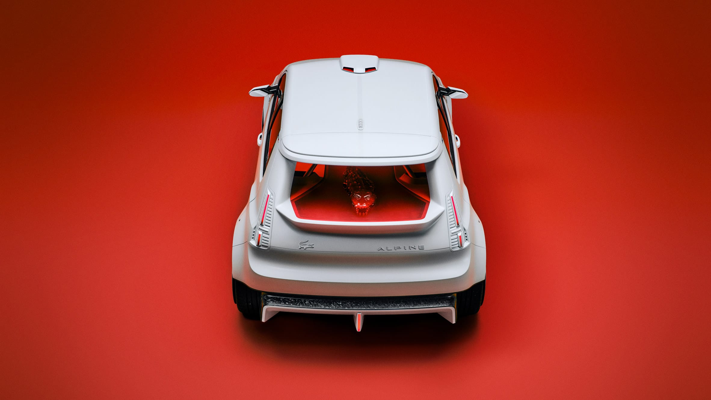 Bovenaanzicht van de achterzijde van een witte Alpine A290_β conceptauto tegen een felrode achtergrond