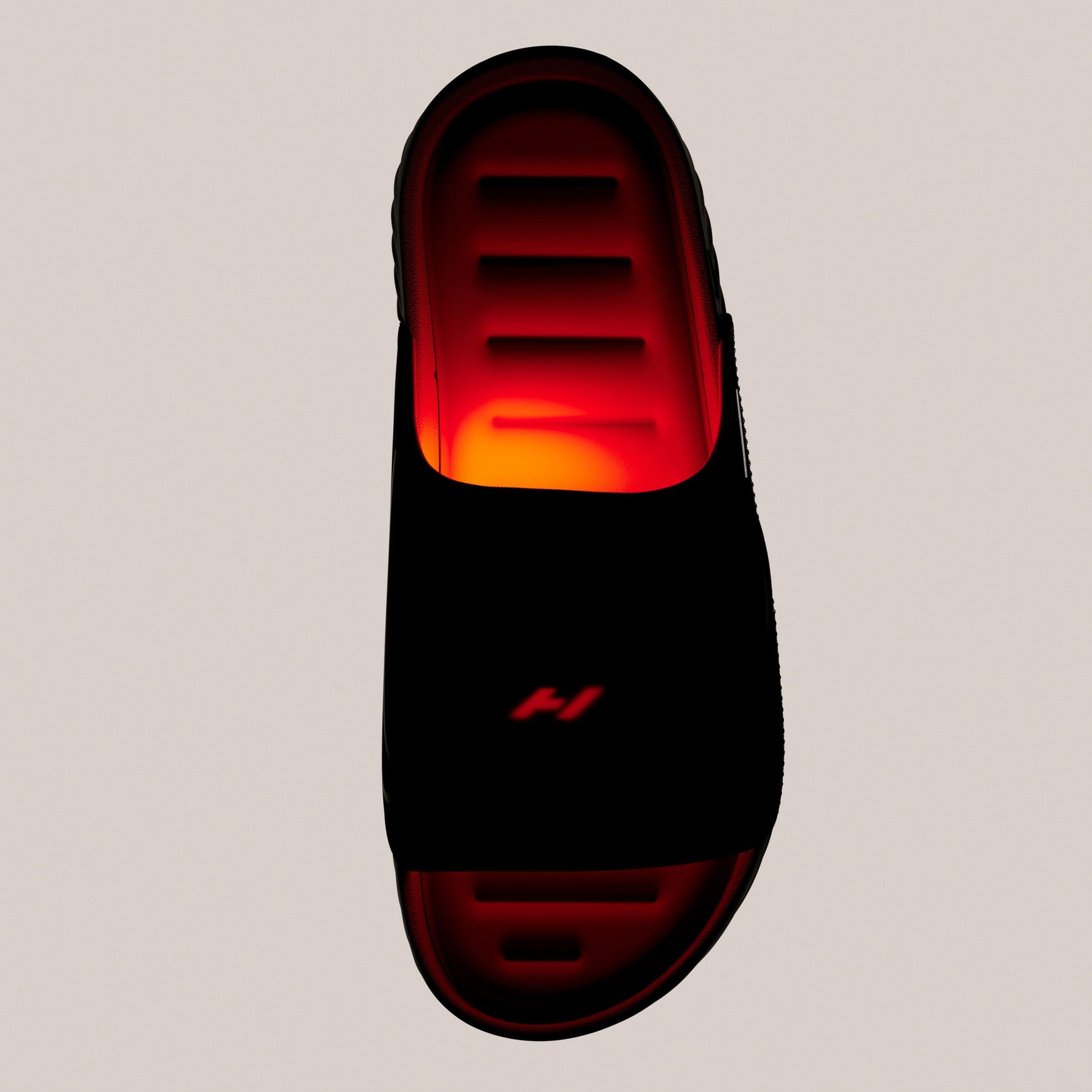 Bovenaanzicht van de Nike Air Zoom Hyperslide slipper met een rood oplichtende band die de warmtefunctie illustreert