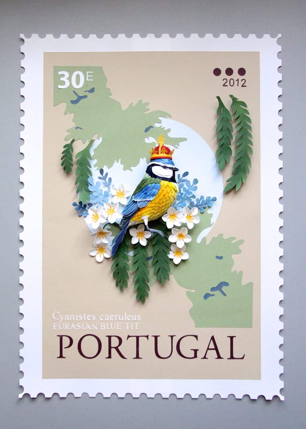 postzegel met papieren vogel